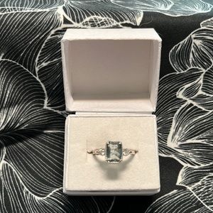 Ring bomb, size 6 lab created smoky blue topaz with white topaz.